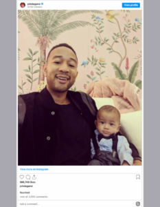 John Legend and Child with Floral Wallpaper